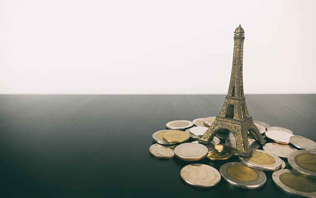 Saving travel money for Paris France Vacation copy space